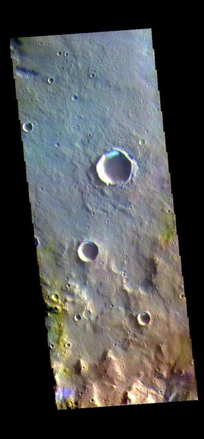 The THEMIS VIS camera contains 5 filters. The data from different filters can be combined in multiple ways to create a false color image. These false color images may reveal subtle variations of the surface not easily identified in a single band image. Today's false color image shows several small, unnamed craters in Terra Sirenum. The bright blue region on the inner crater rim is morning frost. Collected during the winter, south facing slopes stay in shadow and retain frost longer than the rest of the rim already in sunlight. Frosts are only identifiable in multi filter images. Orbit Number: 80442 Latitude: -36.3327 Longitude: 198.274 Instrument: VIS Captured: 2020-02-01 21:41 https://photojournal.jpl.nasa.gov/catalog/PIA24676