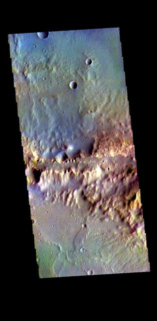 The THEMIS VIS camera contains 5 filters. The data from different filters can be combined in multiple ways to create a false color image. These false color images may reveal subtle variations of the surface not easily identified in a single band image. Today's false color image shows part of the northern rim of Oyama Crater. Located in Arabia Terra near Mawrth Vallis, Oyama Crater is 101km (63 miles) in diameter.  Orbit Number: 81198 Latitude: 24.3956 Longitude: 340.003 Instrument: VIS Captured: 2020-04-04 03:59  https://photojournal.jpl.nasa.gov/catalog/PIA24701