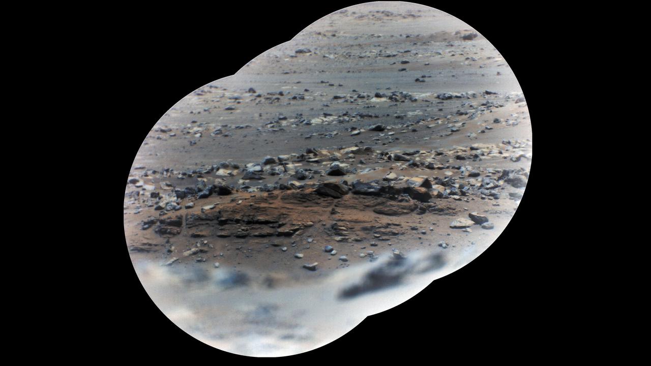 NASA's Perseverance rover took these zoomed-in images of a layered outcrop (just below center of image) nicknamed "Artuby" on June 17, 2021 (the 116th sol, or Martian Day, of its mission), from a little more than a third of a mile (615 meters) away. This mosaic is made up of three images taken by the Remote Microscopic Imager (RMI), part of the rover's SuperCam instrument. Each circular image has a field of view of 37.73 feet (11.50 meters) at this distance. The images were combined using an algorithm that weights the image centers.  The outcrop shows evidence of being formed in an ancient lake. The feature is in the 'Verdon' quadrangle of Mars' Jezero Crater, south of the landing site. Artuby is the name of a river in southern France.  Perseverance has been exploring the floor of Jezero Crater since it landed on Feb. 18, 2021.  SuperCam is led by Los Alamos National Laboratory in New Mexico, where the instrument's Body Unit was developed. That part of the instrument includes several spectrometers as well as control electronics and software.  The Mast Unit, including the RMI used for these images, was developed and built by several laboratories of the CNRS (the French research center) and French universities under the contracting authority of Centre National d'Etudes Spatiales (CNES, the French space agency).  A key objective for Perseverance's mission on Mars is astrobiology, including the search for signs of ancient microbial life. The rover will characterize the planet's geology and past climate, pave the way for human exploration of the Red Planet, and be the first mission to collect and cache Martian rock and regolith (broken rock and dust).  Subsequent NASA missions, in cooperation with ESA (European Space Agency), would send spacecraft to Mars to collect these sealed samples from the surface and return them to Earth for in-depth analysis.  The Mars 2020 Perseverance mission is part of NASA's Moon to Mars exploration approach, which includes Artemis missions to the Moon that will help prepare for human exploration of the Red Planet.  https://photojournal.jpl.nasa.gov/catalog/PIA24747