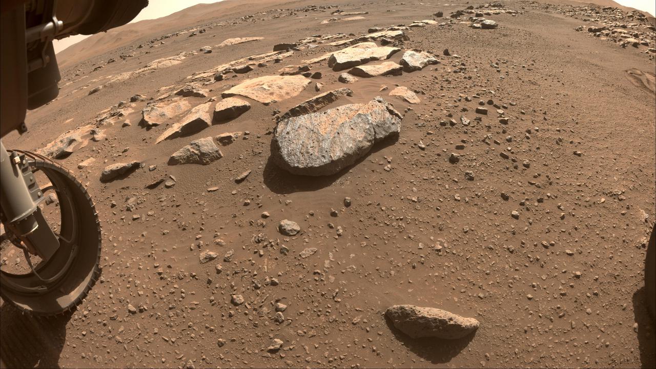 NASA's Perseverance Mars will use a tool on its robotic arm to abrade the rock, nicknamed "Rochette," at the center of this image, allowing scientists to look inside and determine whether to capture a sample with the rover's coring bit. The image was taken by one of the rover's front Hazard Cameras. A key objective for Perseverance's mission on Mars is astrobiology, including the search for signs of ancient microbial life. The rover will characterize the planet's geology and past climate, pave the way for human exploration of the Red Planet, and be the first mission to collect and cache Martian rock and regolith (broken rock and dust). Subsequent NASA missions, in cooperation with ESA (European Space Agency), would send spacecraft to Mars to collect these sealed samples from the surface and return them to Earth for in-depth analysis. The Mars 2020 Perseverance mission is part of NASA's Moon to Mars exploration approach, which includes Artemis missions to the Moon that will help prepare for human exploration of the Red Planet. https://photojournal.jpl.nasa.gov/catalog/PIA24767