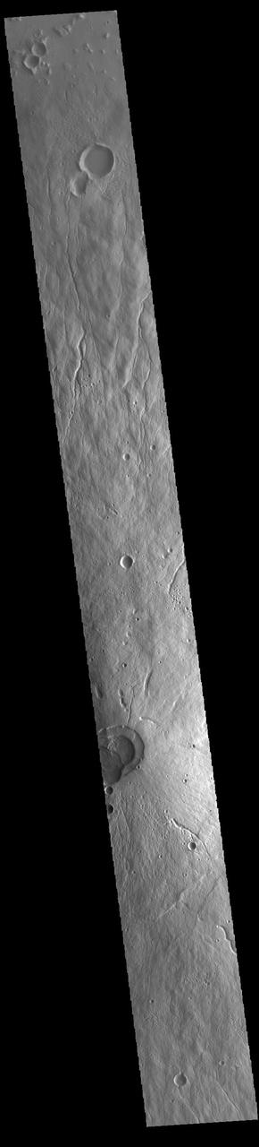 This VIS image crosses most of Hecates Tholus. The circular feature in the bottom half of the image is the summit caldera. This volcano is located on the northern part of the Elysium Volcanic Complex. Hecates Tholus is 5.3 km (3.3 miles) high and 182 km (113 miles) across. Orbit Number: 85360 Latitude: 32.2672 Longitude: 150.166 Instrument: VIS Captured: 2021-03-12 20:36 https://photojournal.jpl.nasa.gov/catalog/PIA24778