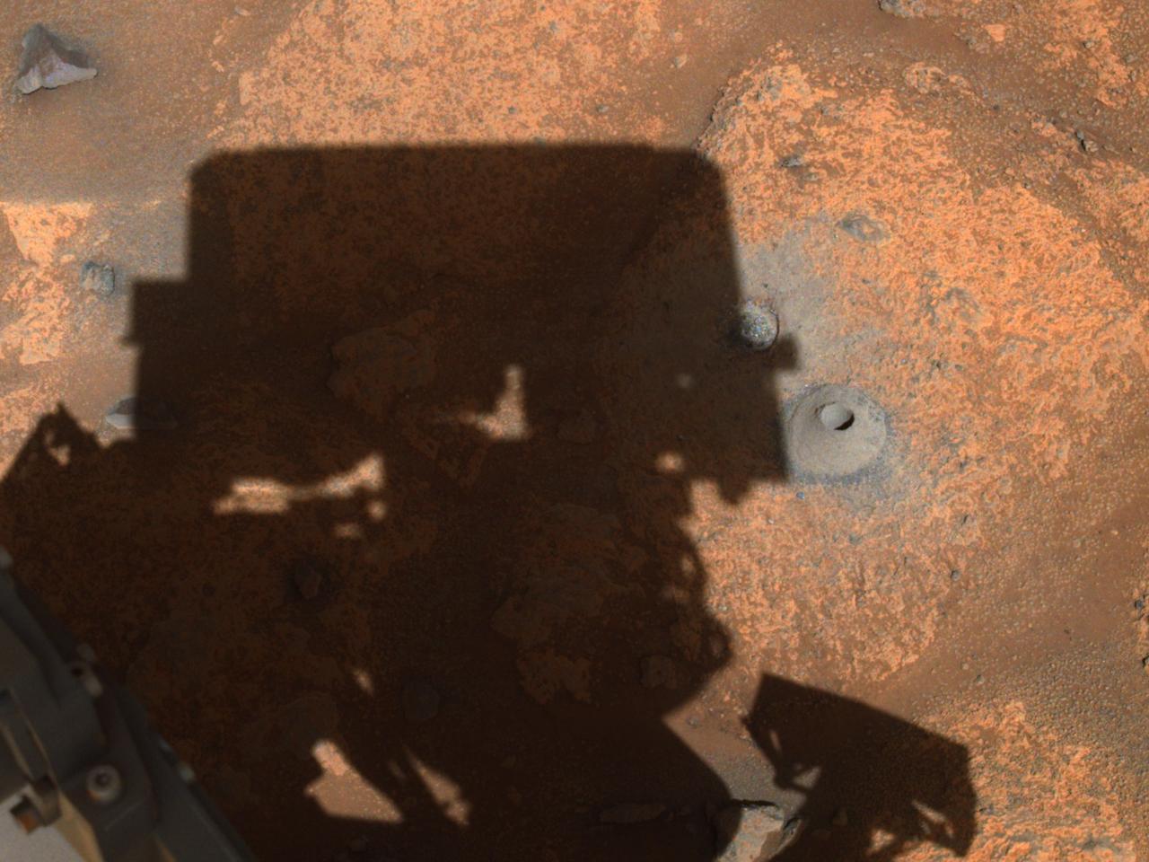 This image of the hole drilled by NASA's Perseverance rover during its first sample-collection attempt was imaged by one of the rover's navigation cameras. The photo was taken on August 6, 2021, in the "Crater Floor Fractured Rough" geologic unit in Mars' Jezero Crater. A key objective for Perseverance's mission on Mars is astrobiology, including the search for signs of ancient microbial life. The rover will characterize the planet's geology and past climate, pave the way for human exploration of the Red Planet, and be the first mission to collect and cache Martian rock and regolith (broken rock and dust). Subsequent NASA missions, in cooperation with ESA (European Space Agency), would send spacecraft to Mars to collect these sealed samples from the surface and return them to Earth for in-depth analysis. The Mars 2020 Perseverance mission is part of NASA's Moon to Mars exploration approach, which includes Artemis missions to the Moon that will help prepare for human exploration of the Red Planet. https://photojournal.jpl.nasa.gov/catalog/PIA24798
