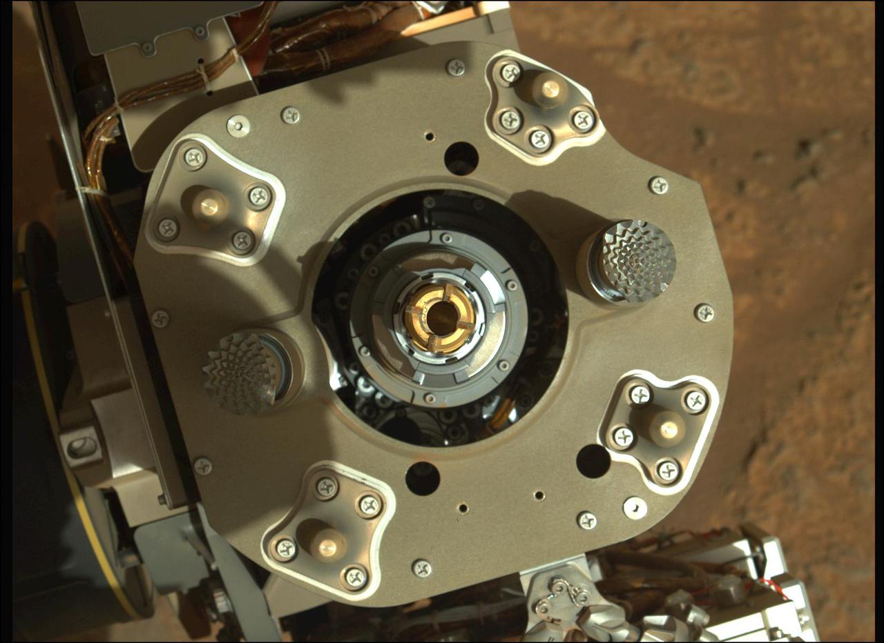This enhanced-color image from the Mastcam-Z instrument aboard NASA's Perseverance rover shows a sample tube inside the coring bit after the August 6, 2021, coring activity was completed. The bronze-colored outer-ring is the coring bit. The lighter-colored inner-ring is the open end of the sample tube. A portion of the tube's serial number – 233 – can be seen on the left side of tube's wall. A key objective for Perseverance's mission on Mars is astrobiology, including the search for signs of ancient microbial life. The rover will characterize the planet's geology and past climate, pave the way for human exploration of the Red Planet, and be the first mission to collect and cache Martian rock and regolith (broken rock and dust). Subsequent NASA missions, in cooperation with ESA (European Space Agency), would send spacecraft to Mars to collect these sealed samples from the surface and return them to Earth for in-depth analysis. The Mars 2020 Perseverance mission is part of NASA's Moon to Mars exploration approach, which includes Artemis missions to the Moon that will help prepare for human exploration of the Red Planet. https://photojournal.jpl.nasa.gov/catalog/PIA24799