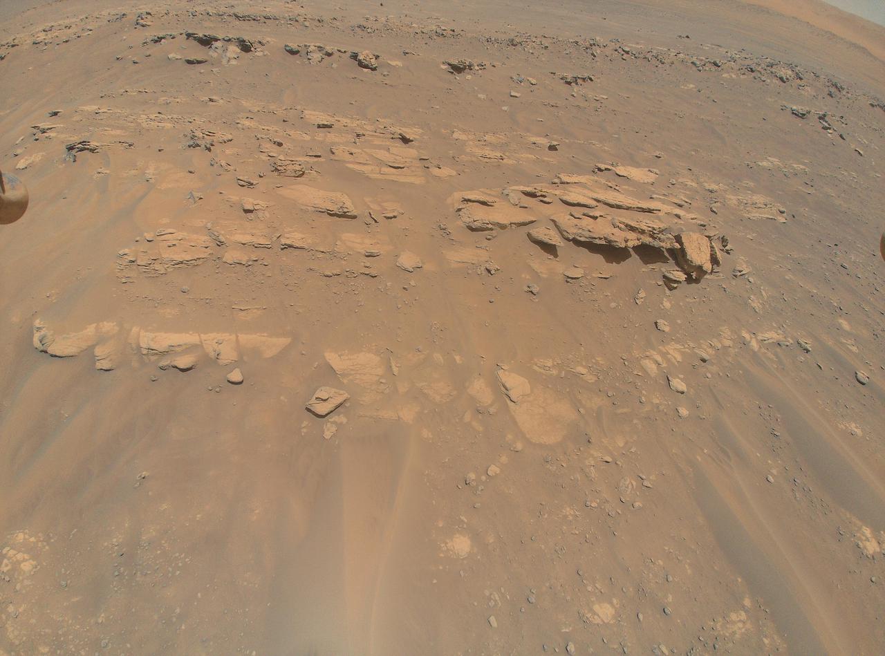 This image of an area the Mars Perseverance rover team calls "Faillefeu" was captured by NASA's Ingenuity Mars Helicopter during its 13th flight at Mars on Sept. 4, 2021. At the time the image was taken, Ingenuity was at an altitude of 26 feet (8 meters). Images of the geologic feature were taken at the request of the Mars Perseverance rover science team, which was considering visiting the geologic feature during the first science campaign.  https://photojournal.jpl.nasa.gov/catalog/PIA24810