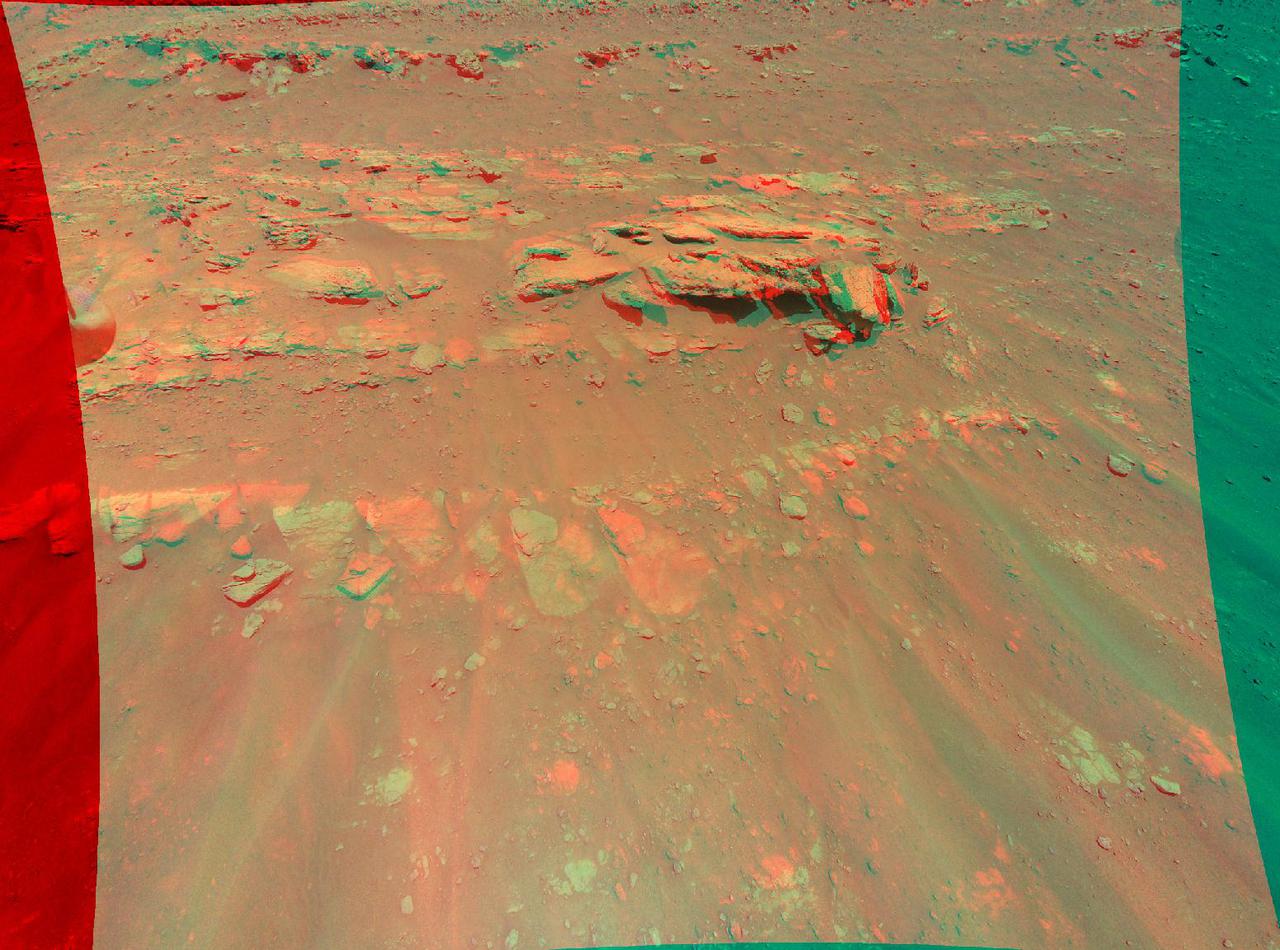 This 3D view of an area the Mars Perseverance rover team calls "Faillefeu" was created from data collected by NASA's Ingenuity Mars Helicopter during its 13th flight at Mars on Sept. 4, 2021. The images used to create the 3D, or anaglyph, picture of the geologic feature were taken at the request of the Mars Perseverance rover science team, which was considering visiting the geologic feature during the first science campaign.  The anaglyph is best viewed with red-blue glasses. It was created by combining data from two images taken 16 feet (5 meters) apart by the color camera aboard Ingenuity. At the time the two images were taken, Ingenuity was at an altitude of 26 feet (8 meters).  https://photojournal.jpl.nasa.gov/catalog/PIA24811