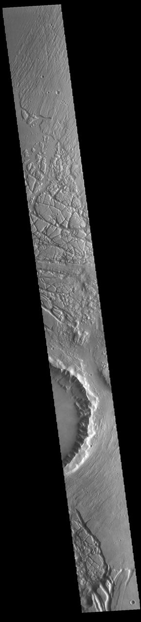 The mesas and valleys in the center of this VIS image are part of Echus Chaos. Located on the margin of Lunae Planum and south of Kasei Valles, Echus Chaos is 480 km (298 miles) long. Orbit Number: 85293 Latitude: 13.7712 Longitude: 285.65 Instrument: VIS Captured: 2021-03-07 08:06 https://photojournal.jpl.nasa.gov/catalog/PIA24825