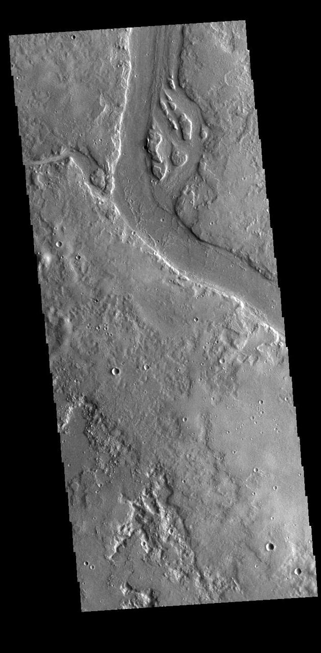 This VIS image shows many of the channel segments of Granicus Valles. Granicus Valles is a complex channel system located west of Elysium Mons. The system is approximately 750km (466 miles) long. It is likely that both water and lava played a part in creation of the feature. Orbit Number: 85523 Latitude: 29.3053 Longitude: 128.19 Instrument: VIS Captured: 2021-03-26 06:42 https://photojournal.jpl.nasa.gov/catalog/PIA24829