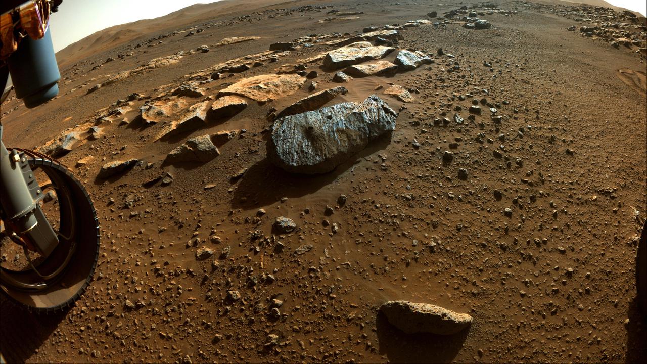 This image taken by NASA's Perseverance rover on Sept. 7, 2021, PDT (Sept. 8, EDT), shows two holes where the rover's drill obtained chalk-size samples from rock nicknamed "Rochette." The hole on the left side is known as "Montagnac" (drilled on Sept. 7), and the hole on the right is known as "Montdenier" (drilled on Sept. 1). A round spot where the rover abraded part of the rock's surface, nicknamed "Bellegarde," is visible under the hole on the right. Tailings (or cuttings) from the Montdenier coring activity slid over Bellegarde. This image in which a rover wheel is visible was taken by one of Perseverance's Hazard Avoidance Cameras on the 196th sol (Martian day) of the rover's mission and processed to enhance contrast. A key objective for Perseverance's mission on Mars is astrobiology, including the search for signs of ancient microbial life. The rover will characterize the planet's geology and past climate, pave the way for human exploration of the Red Planet, and be the first mission to collect and cache Martian rock and regolith (broken rock and dust). The Mars 2020 Perseverance mission is part of NASA's Moon to Mars exploration approach, which includes Artemis missions to the Moon that will help prepare for human exploration of the Red Planet. Subsequent NASA missions, in cooperation with ESA (European Space Agency), would send spacecraft to Mars to collect these sealed samples from the surface and return them to Earth for in-depth analysis. https://photojournal.jpl.nasa.gov/catalog/PIA24840