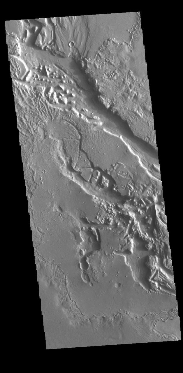 Today's VIS image shows a small section of Hrad Vallis. Hrad Vallis originates on the northwest margin of the Elysium Volcanic complex and flows into Utopia Planitia. Hrad Vallis is 825 km (513 miles) long. Orbit Number: 85822 Latitude: 33.8698 Longitude: 141.725 Instrument: VIS Captured: 2021-04-19 21:35 https://photojournal.jpl.nasa.gov/catalog/PIA24877