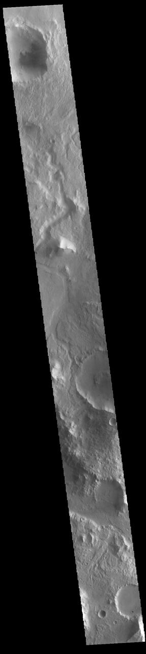 Today's VIS image shows an unnamed channel in Libya Montes. Libya Montes are south of Isidis Planitia, and are remnants of the crater rim created by the Isidis meteor impact. Orbit Number: 85899 Latitude: 2.26071 Longitude: 84.8385 Instrument: VIS Captured: 2021-04-26 05:34 https://photojournal.jpl.nasa.gov/catalog/PIA24886