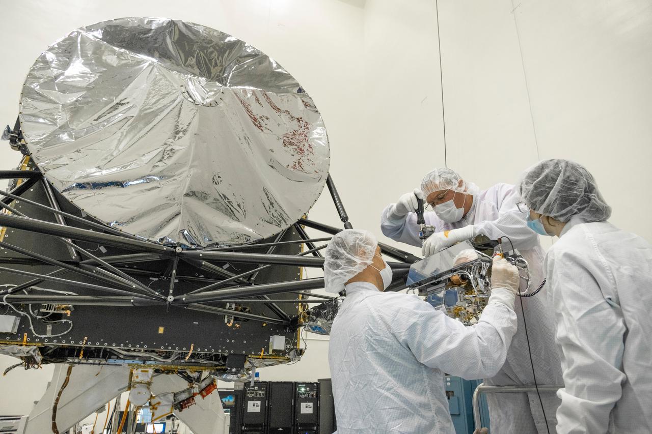 Engineers at NASA's Jet Propulsion Laboratory in Southern California integrate the gamma ray and neutron spectrometer instrument into the agency's Psyche spacecraft on Aug. 23, 2021.  Psyche, set to launch in August 2022, will investigate a metal-rich asteroid of the same name, which lies in the main asteroid belt between Mars and Jupiter. Scientists believe the asteroid could be part or all of the iron-rich interior of an early planetary building block that was stripped of its outer rocky shell as it repeatedly collided with other large bodies during the early formation of the solar system.  The spacecraft will use the GRNS to study the neutrons and gamma rays coming from the asteroid's surface to help determine its elemental composition. As cosmic rays and high energy particles impact the surface of Psyche, the elements that make up the surface material absorb the energy and in response emit neutrons and gamma rays of varying energy levels. These emitted neutrons and gamma rays can be detected by the GRNS and analyzed by scientists, who can match their properties to those emitted by known elements to determine what Psyche is made of.  https://photojournal.jpl.nasa.gov/catalog/PIA24891
