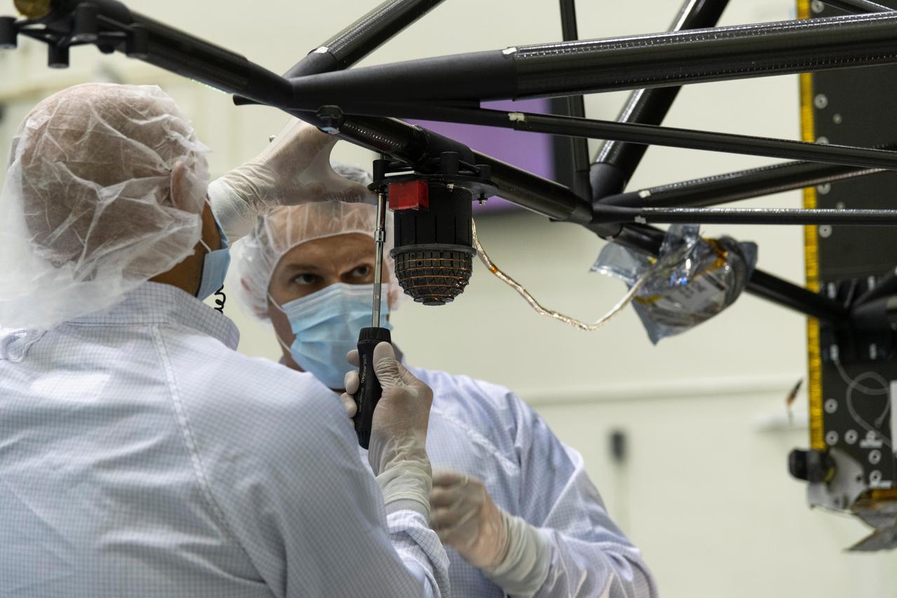 Engineers at NASA's Jet Propulsion Laboratory in Southern California integrate the magnetometer instrument into the agency's Psyche spacecraft on June 28, 2021.  Psyche, set to launch in August 2022, will investigate a metal-rich asteroid of the same name, which lies in the main asteroid belt between Mars and Jupiter. Scientists believe the asteroid could be part or all of the iron-rich interior of an early planetary building block that was stripped of its outer rocky shell as it repeatedly collided with other large bodies during the early formation of the solar system.  Scientists know that the asteroid doesn't generate a magnetic field the way Earth does; but if Psyche had a magnetic field in the past, that magnetic field could still be recorded in Psyche's material today. With sensors mounted onto a 6-foot (2-meter) boom, the magnetometer can determine if Psyche is still magnetized. If so, that would confirm that the asteroid is part of the core of a planetesimal, the building block of an early planet. This photo shows one of the magnetometer's sensors.  https://photojournal.jpl.nasa.gov/catalog/PIA24893