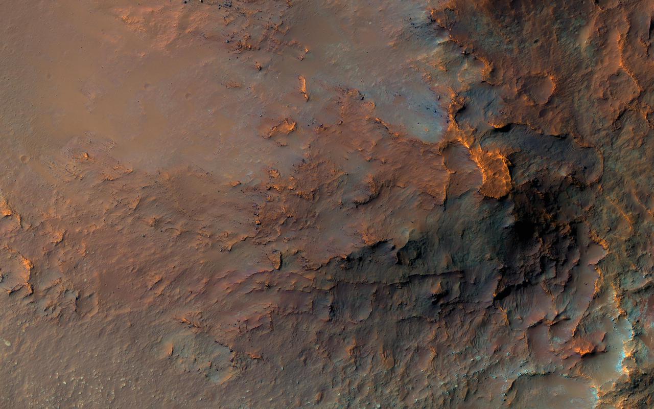 This image was requested in the very first month of MRO's Primary Science Phase, November 2006. Due to many competing targets in the Valles Marineris canyon system, it took nearly 15 years to acquire. But it was worth the wait! A massive landslide has transported diverse rocks from the canyon's wall layers down onto its floor, jumbling them up in the process. Lower-resolution infrared data had previously revealed an unusual concentration of the igneous mineral orthopyroxene at this location. The range of colors visible to HiRISE implies that many other minerals are present here as well. https://photojournal.jpl.nasa.gov/catalog/PIA24913