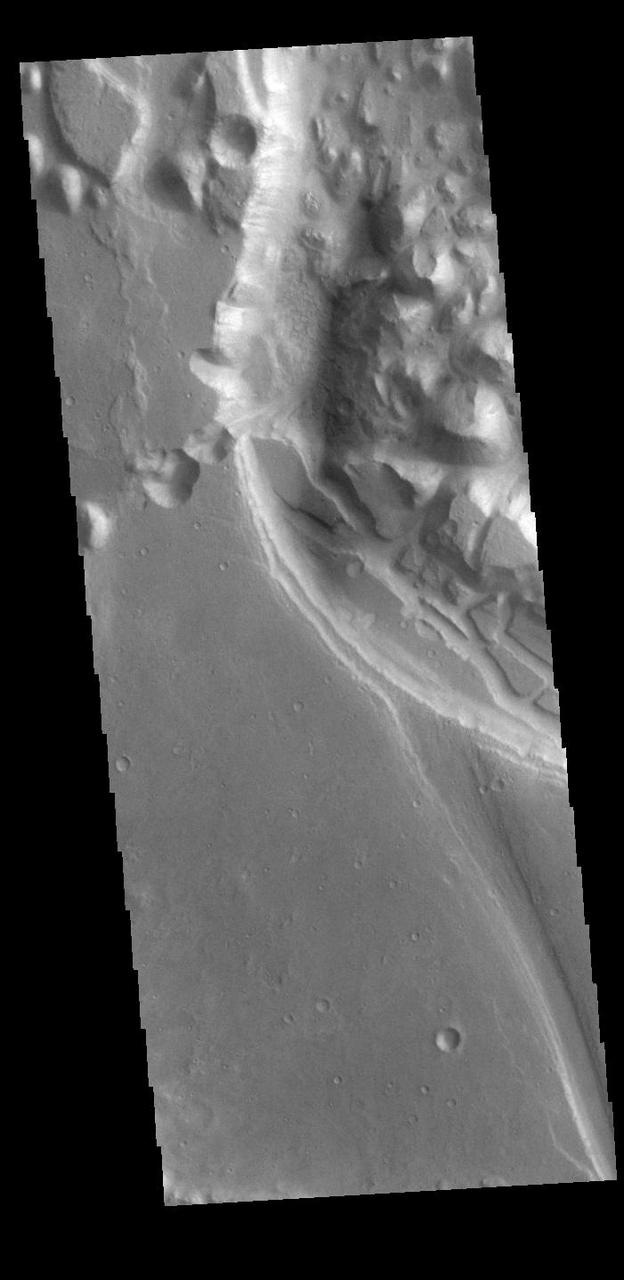 This VIS image shows part of Xanthe Chaos. Xanthe Chaos is a small region of mesas located within Shalbatana Vallis.  In planetary nomenclature, the descriptor term chaos means "distinctive area of broken terrain". The general morphology of chaos is steep-sided mesas with intervening small valleys. With time and erosion the valleys widen and the mesas grow smaller. While on many planets chaos terrain results from tectonic forces, on Mars it is most likely that chaos terrain results from the release of melted subsurface ice.  Orbit Number: 86415 Latitude: 11.6822 Longitude: 317.621 Instrument: VIS Captured: 2021-06-07 17:18  https://photojournal.jpl.nasa.gov/catalog/PIA24954