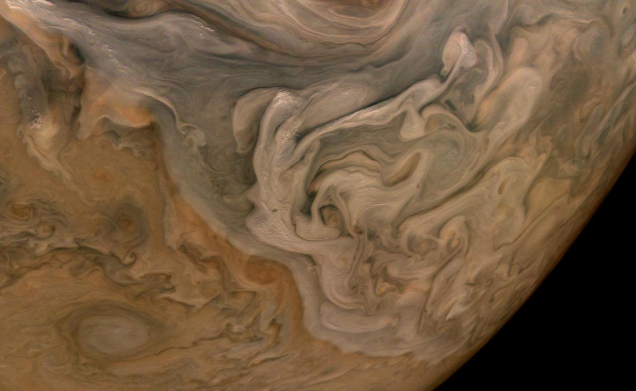 The three-dimensional character of Jupiter's cloud decks is captured in this image of the planet's North Equatorial Belt. Orange storms peek out from under banks of dark gray clouds. Lighter tan and gray clouds cast narrow shadows on the dark gray cloud bank below. At the top are the "pop-up clouds," parcels of air pushed up to the altitude at which ammonia ice condenses to make small, bright clouds.  Jupiter appears to have a pastel hue to the naked eye through an Earth-based telescope. The color in this image from the JunoCam imager aboard NASA's Juno spacecraft has been "exaggerated," processed by citizen scientist Brian Swift to bring out subtle differences. The result is that the cloud layering is more obvious than in the original image.  This image was taken Oct. 16, 2021, at 10:07 a.m. PDT (1:07 p.m. EDT) as Juno performed its 37th close flyby of Jupiter. At the time the image was taken, the spacecraft was about 3,738 miles (6,016 kilometers) from the tops of the clouds of the planet at a latitude of 49.17 degrees.  https://photojournal.jpl.nasa.gov/catalog/PIA24972