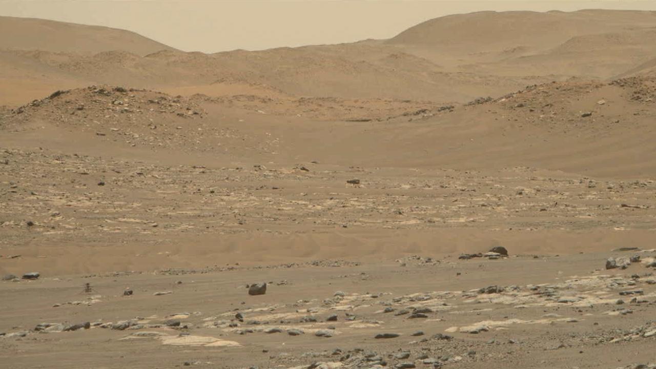 Video footage from the Mastcam-Z instrument aboard NASA's Perseverance Mars rover captured this closeup view of the takeoff and landing of the 13th flight of the Ingenuity Mars Helicopter on Sept. 4, 2021. The 160.5-second reconnaissance sortie involved flying into challenging terrain and taking images of a specific outcrop from multiple angles. The closeup video of takeoff and landing was acquired as part of a science observation intended to measure the dust plumes generated by the helicopter.  At the beginning of the video, Ingenuity is near the lower left of frame, at a distance of about 980 feet (300 meters) from the rover. It climbs to an altitude of to 26 feet (8 meters) before beginning its sideways translation. The helicopter leaves the camera's field of view on the right. Soon after, the helicopter returns into the field of view (the majority of frames that did not capture helicopter after it exited the camera's field of view were purposely not downlinked from Mars by the team) and lands at a location near its takeoff point.  To obtain the footage, the two-camera Mastcam-Z's "right eye" was at its maximum zoom setting (110mm focal length). The video is shot at 6 frames per second. Another view (PIA24978) was taken at the same time by Mastcam-Z's "left eye" imager and provides a wider perspective of the same flight.  The Mastcam-Z investigation is led and operated by Arizona State University in Tempe, working in collaboration with Malin Space Science Systems in San Diego, California, on the design, fabrication, testing, and operation of the cameras, and in collaboration with the Neils Bohr Institute of the University of Copenhagen on the design, fabrication, and testing of the calibration targets.  A key objective for Perseverance's mission on Mars is astrobiology, including the search for signs of ancient microbial life. The rover will characterize the planet's geology and past climate, pave the way for human exploration of the Red Planet, and be the first mission to collect and cache Martian rock and regolith (broken rock and dust).  Subsequent NASA missions, in cooperation with ESA (European Space Agency), would send spacecraft to Mars to collect these sealed samples from the surface and return them to Earth for in-depth analysis.  The Mars 2020 Perseverance mission is part of NASA's Moon to Mars exploration approach, which includes Artemis missions to the Moon that will help prepare for human exploration of the Red Planet.  Movie available at https://photojournal.jpl.nasa.gov/catalog/PIA24979