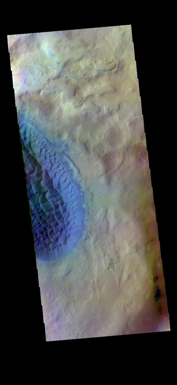The THEMIS VIS camera contains 5 filters. The data from different filters can be combined in multiple ways to create a false color image. These false color images may reveal subtle variations of the surface not easily identified in a single band image. Today's false color image shows the floor of Matara Crater. A large sand sheet dominates the floor of this crater located in Noachis Terra. The top of the sand sheet has been sculpted by the wind, creating dune forms. Matara Crater is 48km (30 miles) in diameter.  The THEMIS VIS camera is capable of capturing color images of the Martian surface using five different color filters. In this mode of operation, the spatial resolution and coverage of the image must be reduced to accommodate the additional data volume produced from using multiple filters. To make a color image, three of the five filter images (each in grayscale) are selected. Each is contrast enhanced and then converted to a red, green, or blue intensity image. These three images are then combined to produce a full color, single image. Because the THEMIS color filters don't span the full range of colors seen by the human eye, a color THEMIS image does not represent true color. Also, because each single-filter image is contrast enhanced before inclusion in the three-color image, the apparent color variation of the scene is exaggerated. Nevertheless, the color variation that does appear is representative of some change in color, however subtle, in the actual scene. Note that the long edges of THEMIS color images typically contain color artifacts that do not represent surface variation.  Orbit Number: 83817 Latitude: -49.4554 Longitude: 34.8949 Instrument: VIS Captured: 2020-11-05 19:05  https://photojournal.jpl.nasa.gov/catalog/PIA25002