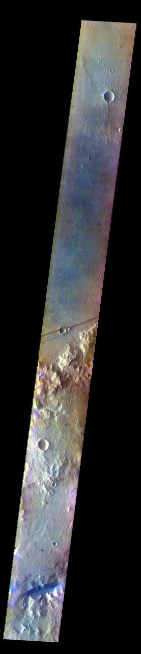 The THEMIS VIS camera contains 5 filters. The data from different filters can be combined in multiple ways to create a false color image. These false color images may reveal subtle variations of the surface not easily identified in a single band image. Today's false color image shows part of Sirenum Fossae. The linear depressions in this VIS image are tectonic graben. Graben are formed by extension of the crust and faulting. When large amounts of pressure or tension are applied to rocks on timescales that are fast enough that the rock cannot respond by deforming, the rock breaks along faults. In the case of a graben, two parallel faults are formed by extension of the crust and the rock in between the faults drops downward into the space created by the extension. Several graben are visible in this THEMIS VIS image, trending from north-northeast to south-southwest. Because the faults defining the graben are formed parallel to the direction of the applied stress, we know that extensional forces were pulling the crust apart in the west-northwest/east-southeast direction. The Sirenum Fossae graben are 2735km (1700 miles) long.  The THEMIS VIS camera is capable of capturing color images of the Martian surface using five different color filters. In this mode of operation, the spatial resolution and coverage of the image must be reduced to accommodate the additional data volume produced from using multiple filters. To make a color image, three of the five filter images (each in grayscale) are selected. Each is contrast enhanced and then converted to a red, green, or blue intensity image. These three images are then combined to produce a full color, single image. Because the THEMIS color filters don't span the full range of colors seen by the human eye, a color THEMIS image does not represent true color. Also, because each single-filter image is contrast enhanced before inclusion in the three-color image, the apparent color variation of the scene is exaggerated. Nevertheless, the color variation that does appear is representative of some change in color, however subtle, in the actual scene. Note that the long edges of THEMIS color images typically contain color artifacts that do not represent surface variation.  Orbit Number: 84841 Latitude: -35.7019 Longitude: 196.266 Instrument: VIS Captured: 2021-01-29 02:03  https://photojournal.jpl.nasa.gov/catalog/PIA25005