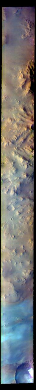 The THEMIS VIS camera contains 5 filters. The data from different filters can be combined in multiple ways to create a false color image. These false color images may reveal subtle variations of the surface not easily identified in a single band image. Today's false color image shows part of Australe Montes. This region of highlands is located near the south polar cap. The pale blue surface at the bottom of the image is likely surface frost.  The THEMIS VIS camera is capable of capturing color images of the Martian surface using five different color filters. In this mode of operation, the spatial resolution and coverage of the image must be reduced to accommodate the additional data volume produced from using multiple filters. To make a color image, three of the five filter images (each in grayscale) are selected. Each is contrast enhanced and then converted to a red, green, or blue intensity image. These three images are then combined to produce a full color, single image. Because the THEMIS color filters don't span the full range of colors seen by the human eye, a color THEMIS image does not represent true color. Also, because each single-filter image is contrast enhanced before inclusion in the three-color image, the apparent color variation of the scene is exaggerated. Nevertheless, the color variation that does appear is representative of some change in color, however subtle, in the actual scene. Note that the long edges of THEMIS color images typically contain color artifacts that do not represent surface variation.  Orbit Number: 84934 Latitude: -81.7965 Longitude: 10.5697 Instrument: VIS Captured: 2021-02-05 18:05  https://photojournal.jpl.nasa.gov/catalog/PIA25008