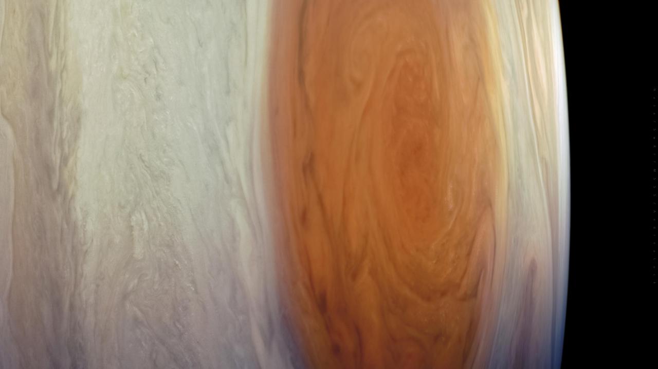NASA's Juno spacecraft captured this detailed look at Jupiter's most recognizable feature, the Great Red Spot.  Data from Juno's instruments indicate this giant, long-lived vortex extends far deeper into Jupiter's atmosphere than scientists previously expected, to about 300 miles (500 kilometers) below the cloud tops. The surprising discovery demonstrates that the Great Red Spot and other vortices descend below the depth where sunlight warms the atmosphere, providing new clues about the inner workings of the planet's beautiful but violent atmosphere. Researchers published the findings in the journal Science in Oct. 2021: https://www.nasa.gov/press-release/nasa-s-juno-science-results-offer-first-3d-view-of-jupiter-atmosphere  Citizen scientist Andrea Luck processed this image from raw JunoCam data. The original image was taken on July 10, 2017, at 07:10 p.m. PDT (10:10 p.m. EDT), as the Juno spacecraft performed its seventh close flyby of Jupiter. At the time, the spacecraft was about 8,600 miles (13,840 kilometers) from the cloud tops, above latitude 33 degrees south.  https://photojournal.jpl.nasa.gov/catalog/PIA25011