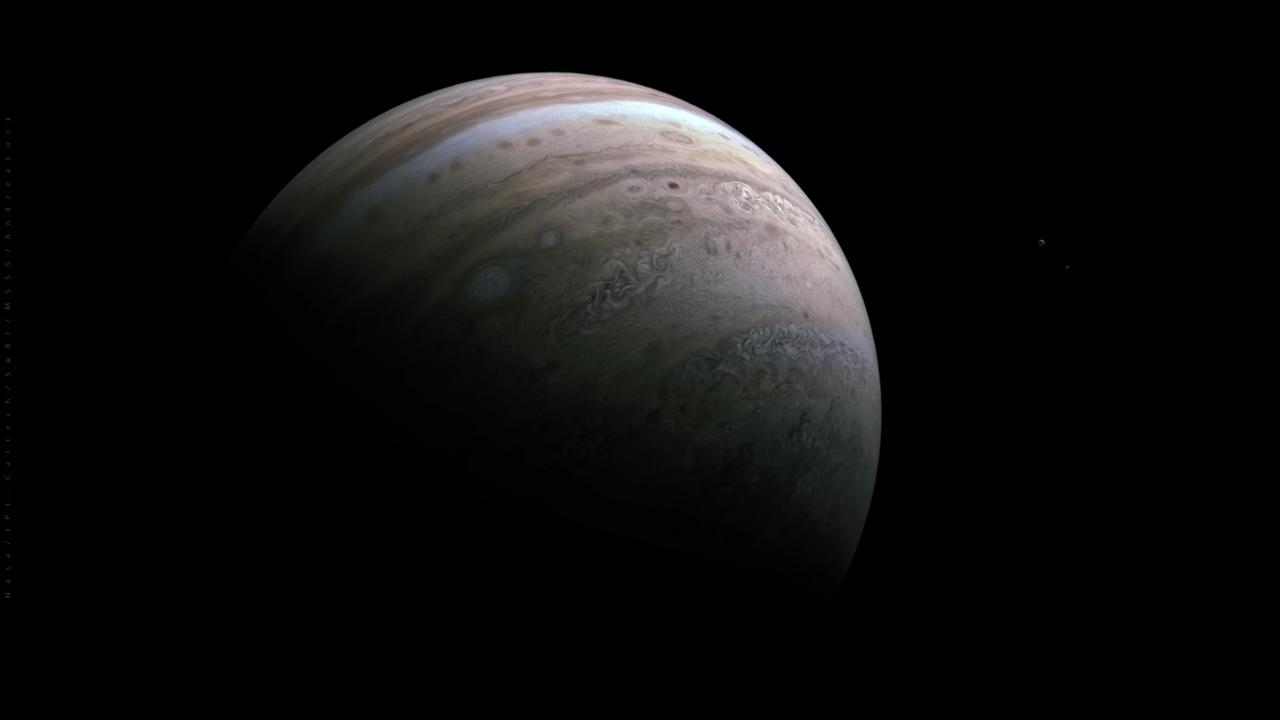 NASA's Juno mission captured this view of Jupiter's southern hemisphere during the spacecraft's 39th close flyby of the planet on Jan. 12, 2022. Zooming in on the right portion of the image (Figure 1) reveals two more worlds in the same frame: Jupiter’s intriguing moons Io (left) and Europa (right). Io is the solar system's most volcanic body, while Europa's icy surface hides a global ocean of liquid water beneath. Juno will have an opportunity to capture much more detailed observations of Europa – using several scientific instruments – in September 2022, when the spacecraft makes the closest fly-by of the enigmatic moon in decades. The mission will also make close approaches to Io in late 2023 and early 2024. At the time this image was taken, the Juno spacecraft was about 38,000 miles (61,000 kilometers) from Jupiter's cloud tops, at a latitude of about 52 degrees south. Citizen scientist Andrea Luck created the image using raw data from the JunoCam instrument. https://photojournal.jpl.nasa.gov/catalog/PIA25014