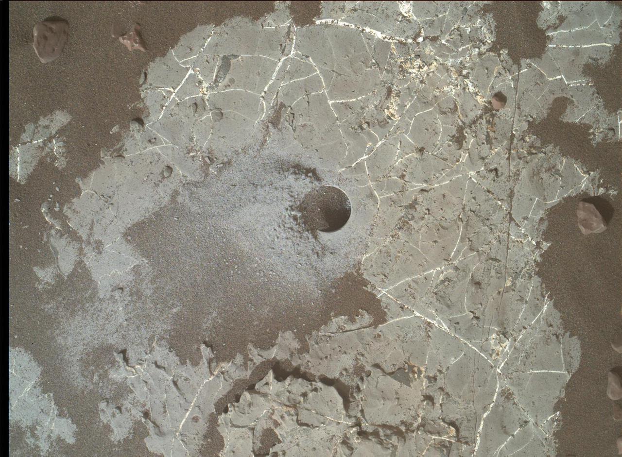 This image shows the Highfield drill hole made by NASA's Curiosity rover as it was collecting a sample on "Vera Rubin Ridge" in Gale Crater on Mars. Drill powder from this hole was enriched in carbon-12. The image was taken by the Mars Hand Lens Imager on Dec. 10, 2021, the 2,247th Martian day, or sol, of the mission.  https://photojournal.jpl.nasa.gov/catalog/PIA25045
