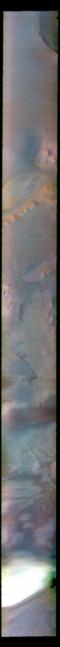 The THEMIS VIS camera contains 5 filters. The data from different filters can be combined in multiple ways to create a false color image. These false color images may reveal subtle variations of the surface not easily identified in a single band image. Today's false color image shows part of Argentea Planum. The edge of the south polar cap is visible at the bottom of the image.  The THEMIS VIS camera is capable of capturing color images of the Martian surface using five different color filters. In this mode of operation, the spatial resolution and coverage of the image must be reduced to accommodate the additional data volume produced from using multiple filters. To make a color image, three of the five filter images (each in grayscale) are selected. Each is contrast enhanced and then converted to a red, green, or blue intensity image. These three images are then combined to produce a full color, single image. Because the THEMIS color filters don't span the full range of colors seen by the human eye, a color THEMIS image does not represent true color. Also, because each single-filter image is contrast enhanced before inclusion in the three-color image, the apparent color variation of the scene is exaggerated. Nevertheless, the color variation that does appear is representative of some change in color, however subtle, in the actual scene. Note that the long edges of THEMIS color images typically contain color artifacts that do not represent surface variation.  Orbit Number: 85035 Latitude: -82.5422 Longitude: 335.069 Instrument: VIS Captured: 2021-02-14 01:40  https://photojournal.jpl.nasa.gov/catalog/PIA25051