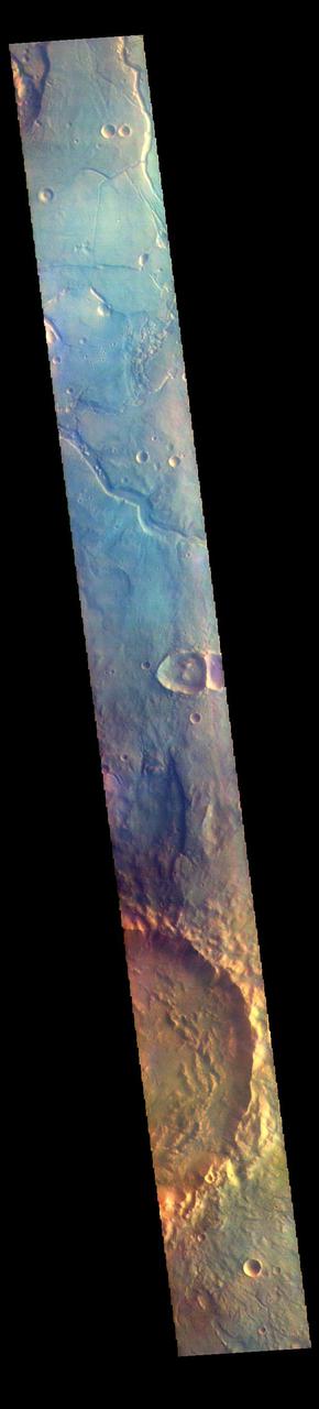 The THEMIS VIS camera contains 5 filters. The data from different filters can be combined in multiple ways to create a false color image. These false color images may reveal subtle variations of the surface not easily identified in a single band image. Today's false color image shows part of northwestern Arabia Terra. The channels in the top part of the image are all unnamed. They are draining from the highlands of Arabia Terra into the lowlands of Acidalia Planitia.  The THEMIS VIS camera is capable of capturing color images of the Martian surface using five different color filters. In this mode of operation, the spatial resolution and coverage of the image must be reduced to accommodate the additional data volume produced from using multiple filters. To make a color image, three of the five filter images (each in grayscale) are selected. Each is contrast enhanced and then converted to a red, green, or blue intensity image. These three images are then combined to produce a full color, single image. Because the THEMIS color filters don't span the full range of colors seen by the human eye, a color THEMIS image does not represent true color. Also, because each single-filter image is contrast enhanced before inclusion in the three-color image, the apparent color variation of the scene is exaggerated. Nevertheless, the color variation that does appear is representative of some change in color, however subtle, in the actual scene. Note that the long edges of THEMIS color images typically contain color artifacts that do not represent surface variation.  Orbit Number: 85453 Latitude: 32.3047 Longitude: 347.214 Instrument: VIS Captured: 2021-03-20 12:23  https://photojournal.jpl.nasa.gov/catalog/PIA25057