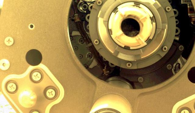 This image taken by the front left hazard camera (hazcam) aboard NASA's Mars Perseverance rover shows the cored-rock sample remaining in the sample tube after the drill bit was extracted from the bit carousel on Jan. 7, 2022. The sample was collected from a rock in the "South Séítah" region of Jezero Crater on Dec. 29, 2021. This image has been processed to enhance contrast. A key objective for Perseverance's mission on Mars is astrobiology, including the search for signs of ancient microbial life. The rover will characterize the planet's geology and past climate, pave the way for human exploration of the Red Planet, and be the first mission to collect and cache Martian rock and regolith (broken rock and dust). Subsequent NASA missions, in cooperation with ESA (European Space Agency), would send spacecraft to Mars to collect these sealed samples from the surface and return them to Earth for in-depth analysis. The Mars 2020 Perseverance mission is part of NASA's Moon to Mars exploration approach, which includes Artemis missions to the Moon that will help prepare for human exploration of the Red Planet. https://photojournal.jpl.nasa.gov/catalog/PIA25067