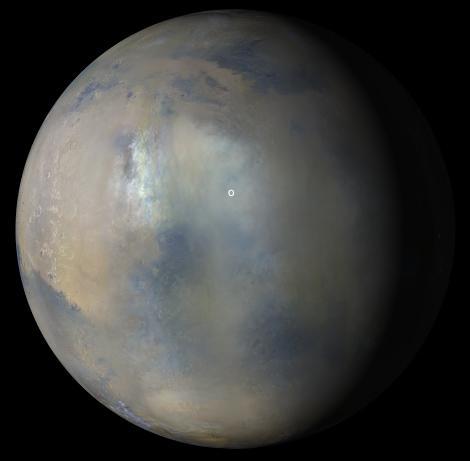 Multiple images from the Mars Color Imager (MARCI) aboard NASA's Mars Reconnaissance Orbiter (MRO) were used to generate this view of a regional dust storm obscuring Syrtis Major and Jezero Crater (white circle). The images were acquired on Jan. 9, 2022.  MRO creates global maps of Mars but roll maneuvers for targeted observations produce gaps in the coverage, which appear as black gores in the maps. On some days there are data drops where partial or full orbits of coverage are missing. Green and purple observed in the south polar region indicate saturated pixels.  https://photojournal.jpl.nasa.gov/catalog/PIA25068