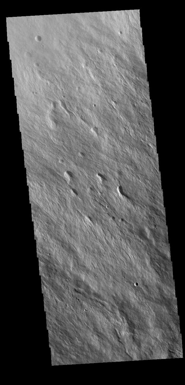 Today's VIS image shows part of the northwestern upper flank of Ascraeus Mons. Lava flows and collapse features cover the flank of the volcano. Ascraeus Mons is the northernmost of the three large Tharsis volcanoes and is the tallest at 18km (11 miles) high. For comparison Mauna Kea – the tallest volcano on Earth – is 10 km tall (6.2 miles, measured from the base below sea level). Orbit Number: 88002 Latitude: 12.7202 Longitude: 254.248 Instrument: VIS Captured: 2021-10-16 09:24 https://photojournal.jpl.nasa.gov/catalog/PIA25104