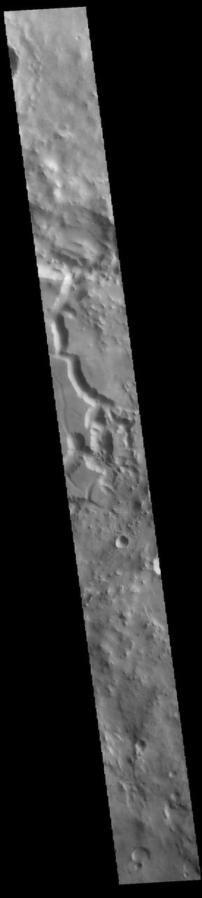 This VIS image crosses an unnamed crater in Terra Sabaea. The entire crater floor is covered by materials of unknown origin. Those materials are be eroded and appear to be forming chaos. The channel feature may be related to fluid activity, where the underlying material is losing water and the surface is collapsing – rather than the flow of a river over the surface.  Orbit Number: 88009 Latitude: 2.76492 Longitude: 53.6692 Instrument: VIS Captured: 2021-10-16 23:10  https://photojournal.jpl.nasa.gov/catalog/PIA25109