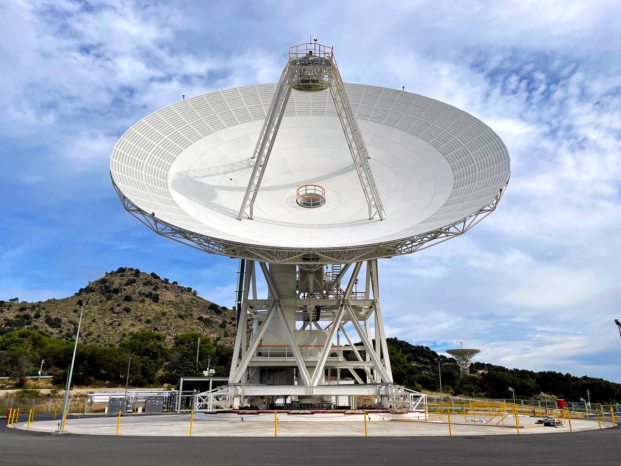 Deep Space Station 53, or DSS-53, is a new 34-meter (111-foot) beam waveguide antenna that went online in February 2022 at NASA's Deep Space Network's ground station in Madrid.  DSS-53 is the fourth of six antennas being added to expand the DSN's capacity and meet the needs of a growing number of spacecraft. When the project is complete, each of the network's three ground stations around the globe will have four beam waveguide antennas. The Madrid Deep Space Communications Complex is the first to have completed its build-out as part of project. Construction on DSS-53 began in 2016.  https://photojournal.jpl.nasa.gov/catalog/PIA25136