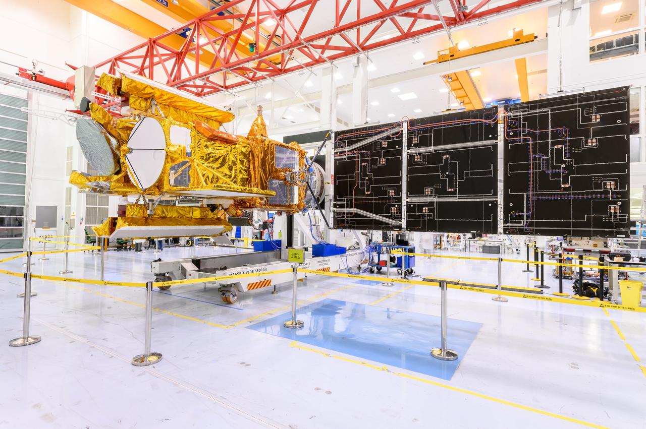 The solar panels on the Surface Water and Ocean Topography (SWOT) satellite unfold as part of a test in January 2022 at a Thales Alenia Space manufacturing facility near Cannes, France. The SWOT mission is being jointly led by NASA and the French space agency Centre National d'Études Spatiales (CNES), with contributions from the Canadian Space Agency and the United Kingdom Space Agency.  Many of SWOT's radar instruments were built at NASA's Jet Propulsion Laboratory in Southern California before being transported to France, where Thales Alenia is assembling the full satellite. Following a series of tests, SWOT will be transported to Vandenberg Space Force Base in Southern California for launch in November 2022. In orbit, SWOT will collect information of unprecedented detail on sea-level height, which will help scientists study the role of ocean currents in moderating climate change, as well as the elevations of fresh water bodies, which will enable researchers for the first time to take inventory of the planet's rivers, lakes, reservoirs, and other surface water.  https://photojournal.jpl.nasa.gov/catalog/PIA25147