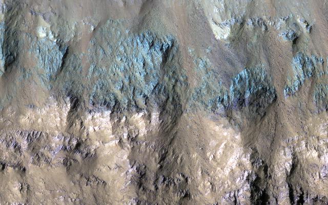 NASA image: Varied Types of Rock in a Crater in Eos Chasma