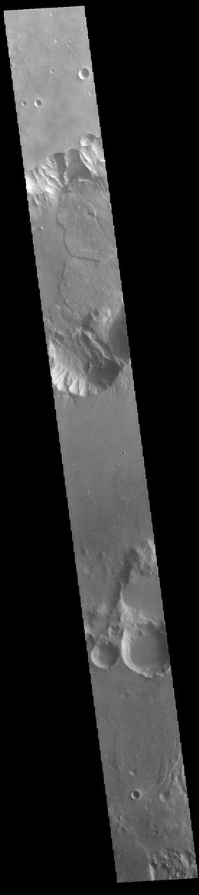 Today's VIS image shows a small section of Capri Chasma. Landslide deposits dominate this part of Capri Chasma. The downslope movement of materials flowed all the way to the center of the chasm, with the one from the northern cliff overlapping one from the southern cliff. Radial grooves and lobate margins are common on martian landslides. Orbit Number: 88212 Latitude: -8.70795 Longitude: 318.685 Instrument: VIS Captured: 2021-11-02 16:16 https://photojournal.jpl.nasa.gov/catalog/PIA25194