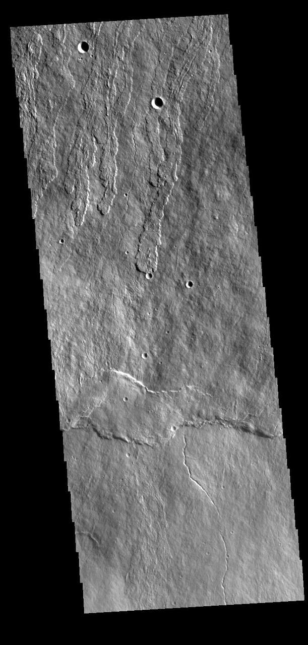 Today's VIS image shows part of the flank of Ascraeus Mons. Thin lava flows are visible. Ascraeus Mons is the northernmost of the three large Tharsis volcanoes and is the tallest at 18km (11 miles) high. Orbit Number: 87403 Latitude: 10.0053 Longitude: 255.249 Instrument: VIS Captured: 2021-08-28 01:41 https://photojournal.jpl.nasa.gov/catalog/PIA25222