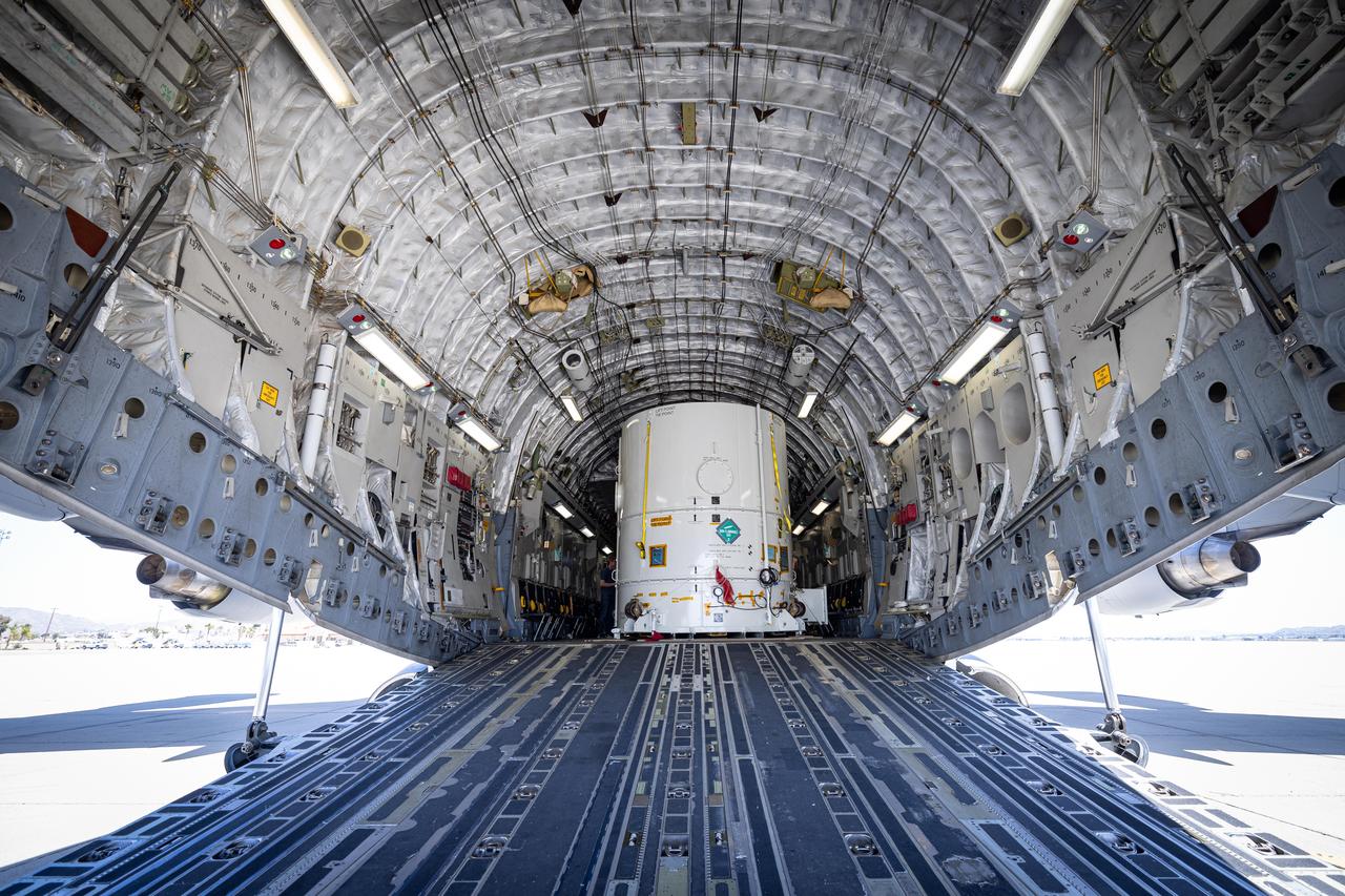 The main body of NASA's Europa Clipper spacecraft is seen in its shipping container, just after arriving aboard a C-17 cargo plane at March Air Reserve Base in Riverside County, California. From there it was delivered by truck to the agency's Jet Propulsion Laboratory in Southern California, where, over the next two years, engineers and technicians will finish assembling the craft by hand. Then it will be tested to make sure it can withstand the journey to Jupiter's icy moon Europa.  The Johns Hopkins Applied Physics Laboratory (APL) in Laurel, Maryland, designed and built the spacecraft body in collaboration with JPL and NASA's Goddard Space Flight Center in Greenbelt, Maryland.  Set to launch in October 2024, Europa Clipper will conduct nearly 50 flybys of Europa, which scientists are confident harbors an internal ocean containing twice as much water as Earth's oceans combined. And the moon may currently have conditions suitable for supporting life. The spacecraft's nine science instruments will gather data on the moon's atmosphere, surface, and interior – information that scientists will use to gauge the depth and salinity of the ocean, the thickness of the ice crust, and potential plumes that may be venting subsurface water into space.  https://photojournal.jpl.nasa.gov/catalog/PIA25238