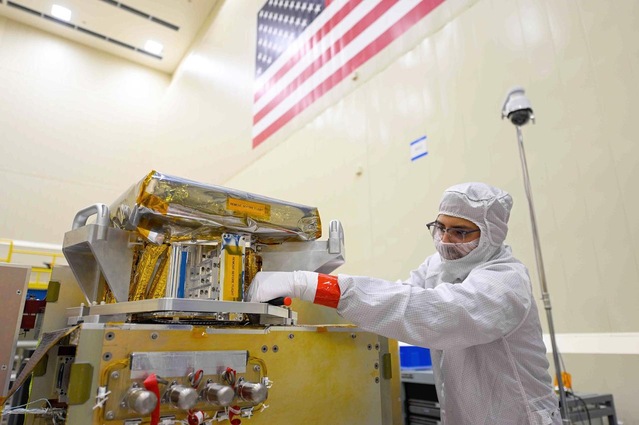 An engineer works on the High-resolution Volatiles and Minerals Moon Mapper (HVM³) for NASA's Lunar Trailblazer spacecraft in a clean room at Lockheed Martin Space in Littleton, Colorado, shortly after the instrument delivered in December 2022. HVM³ is an imaging spectrometer that was developed at NASA's Jet Propulsion Laboratory in Southern California. It was shipped from JPL to Lockheed Martin Space, where it was integrated with the spacecraft.  HVM³ is one of two instruments that will be used by the mission to detect and map water on the Moon's surface to determine its abundance, location, form, and how it changes over time. Lunar Trailblazer was selected under NASA's Small Innovative Missions for Planetary Exploration (SIMPLEx) program in 2019.  The Lunar Trailblazer mission is managed by JPL and its science investigation is led by Caltech in Pasadena, California. Managed for NASA by Caltech, JPL also provides system engineering, mission assurance, the HVM³ instrument, as well as navigation. Lockheed Martin Space provides the spacecraft and integrates the flight system, under contract with Caltech.  SIMPLEx mission investigations are managed by the Planetary Missions Program Office at NASA's Marshall Space Flight Center in Huntsville, Alabama, as part of the Discovery Program at NASA Headquarters in Washington. The program conducts space science investigations in the Planetary Science Division of NASA's Science Mission Directorate at NASA Headquarters.  https://photojournal.jpl.nasa.gov/catalog/PIA25255
