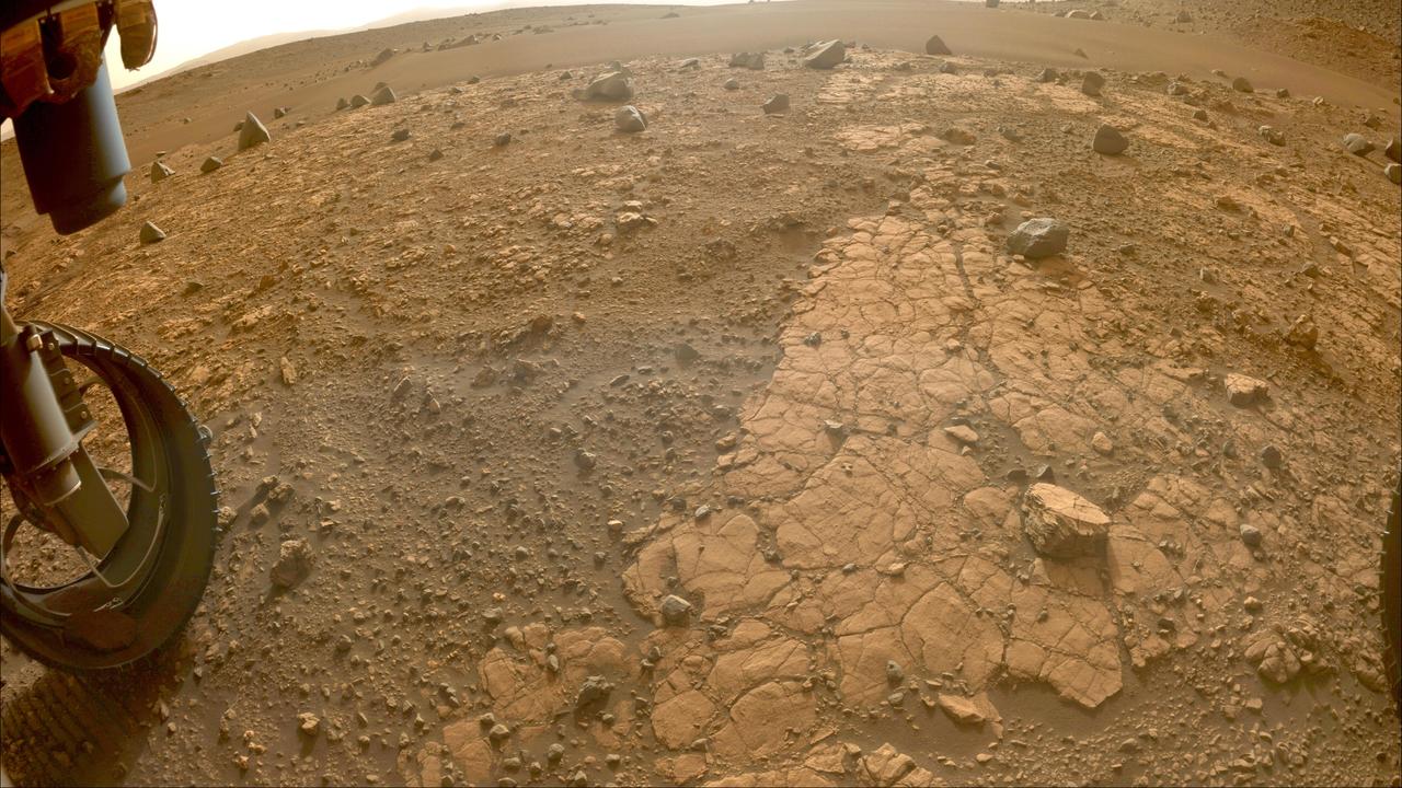 This image of "Yori Pass" was taken by one of the Hazard-Avoidance Cameras (Hazcams) on NASA's Perseverance Mars rover on Nov. 5, 2022, the 609th Martian day, or sol, of the mission. The feature, at the base of Jezero Crater, is sandstone, which is composed of fine grains that have been carried from elsewhere by water before settling and forming stone. The rover will take a rock-core sample here. A key objective for Perseverance's mission on Mars is astrobiology, including the search for signs of ancient microbial life. The rover will characterize the planet's geology and past climate, pave the way for human exploration of the Red Planet, and be the first mission to collect and cache Martian rock and regolith (broken rock and dust). Subsequent NASA missions, in cooperation with ESA (European Space Agency), would send spacecraft to Mars to collect these sealed samples from the surface and return them to Earth for in-depth analysis. The Mars 2020 Perseverance mission is part of NASA's Moon to Mars exploration approach, which includes Artemis missions to the Moon that will help prepare for human exploration of the Red Planet. https://photojournal.jpl.nasa.gov/catalog/PIA25339