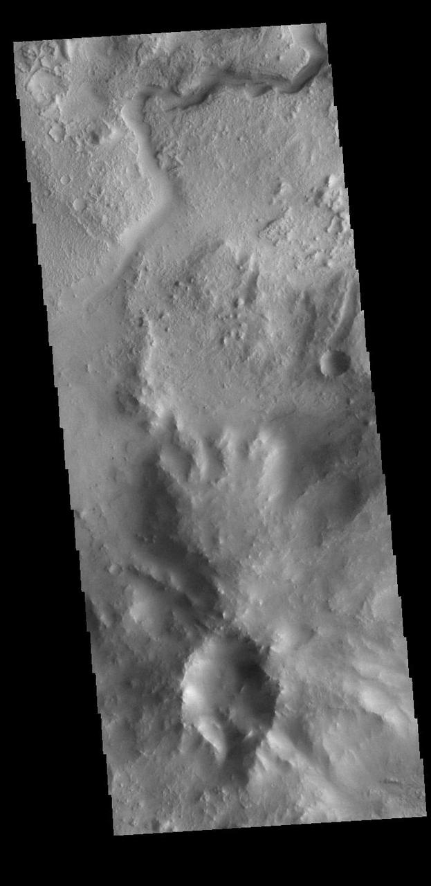 Today's VIS image shows part of the northeastern portion of Jezero Crater. The Perserverance Rover is located on the northwestern part of the crater – near a delta deposit formed by the influx of silt laden water into the crater at a time during Mars' past that was wetter. The crater most likely hosted a lake for a period of time. The channel at the top of this image was formed by the flow of water exiting the crater. Orbit Number: 89206 Latitude: 18.3845 Longitude: 78.1952 Instrument: VIS Captured: 2022-01-23 12:45 https://photojournal.jpl.nasa.gov/catalog/PIA25350