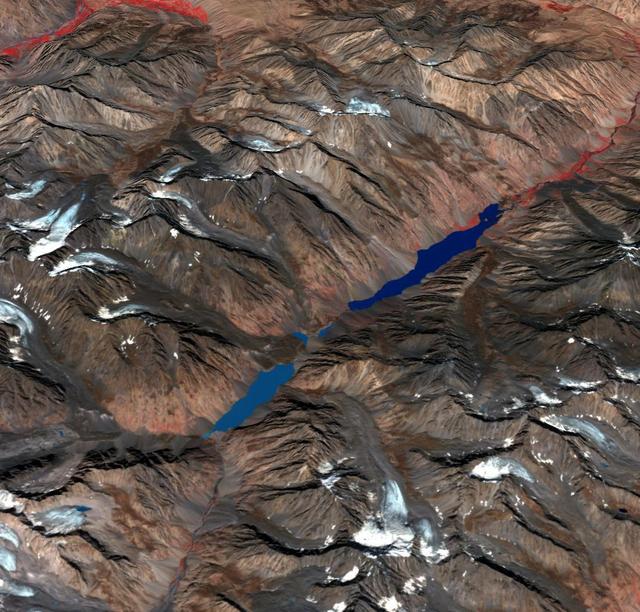 In the Hindu Kush Mtns. in northern Pakistan, landslides from the steep, glaciated terrain are common. When the landslides block rivers, they form temporary lakes or cause small lakes to grow larger. If the landslide dams fail catastrophically, an instantaneous flood surges down the narrow valley, endangering downstream villages. A good example is Lake Shuwarang Chhat, that is upstream of villages of Barsat, Tery, Bahach, and Hundarap. The perspective view data were acquired September23, 2019, and are located at 36 degrees north, 72.6 degrees east.  https://photojournal.jpl.nasa.gov/catalog/PIA25355