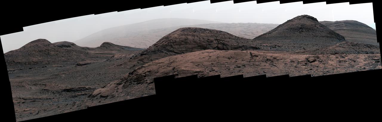 NASA's Curiosity Mars rover captured this image of the sulfate-bearing region and upper Mount Sharp in a dust haze on May 26, 2022, the 3,485th Martian day, or sol, of the mission. The panorama is made up of 46 individual images – captured during an especially dusty time of the Martian year – that were stitched together once the images were sent back to Earth. https://photojournal.jpl.nasa.gov/catalog/PIA25365