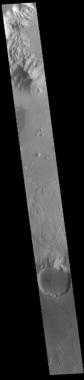 Today's VIS image shows part of Ganges Chasma. A large landslide deposit is visible in the center of the image. The radial grooves on the top of a landslide are a common feature formed by the downslope movement of the landslide materials. Ganges Chasma is part of the Valles Marineris chasma system, but is north of the main section of canyons. Ganges Chasma is 584km (363 miles) long.  Orbit Number: 89435 Latitude: -8.15265 Longitude: 315.105 Instrument: VIS Captured: 2022-02-11 09:09  https://photojournal.jpl.nasa.gov/catalog/PIA25371