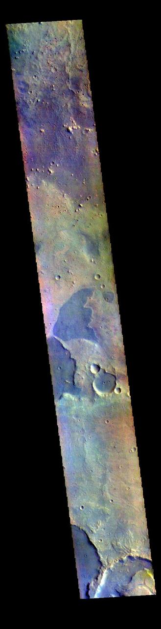 The THEMIS VIS camera contains 5 filters. The data from different filters can be combined in multiple ways to create a false color image. These false color images may reveal subtle variations of the surface not easily identified in a single band image. Today's false color image shows part of northern Arabia Terra. Arabia Terra is one of the oldest surface regions on Mars and contains a large variety of surface features. The region is dissected with numerous unnamed channels of all sizes and complexities, as well as numerous pits of unknown origin.  The THEMIS VIS camera is capable of capturing color images of the Martian surface using five different color filters. In this mode of operation, the spatial resolution and coverage of the image must be reduced to accommodate the additional data volume produced from using multiple filters. To make a color image, three of the five filter images (each in grayscale) are selected. Each is contrast enhanced and then converted to a red, green, or blue intensity image. These three images are then combined to produce a full color, single image. Because the THEMIS color filters don't span the full range of colors seen by the human eye, a color THEMIS image does not represent true color. Also, because each single-filter image is contrast enhanced before inclusion in the three-color image, the apparent color variation of the scene is exaggerated. Nevertheless, the color variation that does appear is representative of some change in color, however subtle, in the actual scene. Note that the long edges of THEMIS color images typically contain color artifacts that do not represent surface variation.  Orbit Number: 87213 Latitude: 18.2378 Longitude: 335.439 Instrument: VIS Captured: 2021-08-12 10:16  https://photojournal.jpl.nasa.gov/catalog/PIA25381