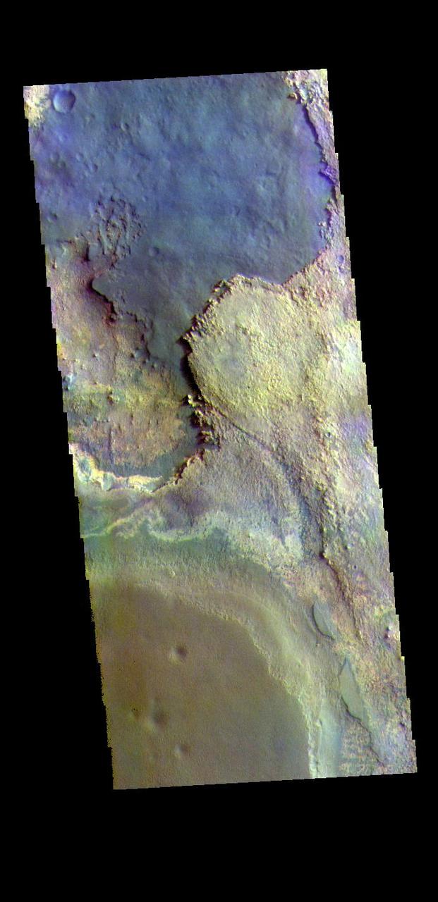 The THEMIS VIS camera contains 5 filters. The data from different filters can be combined in multiple ways to create a false color image. These false color images may reveal subtle variations of the surface not easily identified in a single band image. Today's false color image shows part of Meridiani Planum.  The THEMIS VIS camera is capable of capturing color images of the Martian surface using five different color filters. In this mode of operation, the spatial resolution and coverage of the image must be reduced to accommodate the additional data volume produced from using multiple filters. To make a color image, three of the five filter images (each in grayscale) are selected. Each is contrast enhanced and then converted to a red, green, or blue intensity image. These three images are then combined to produce a full color, single image. Because the THEMIS color filters don't span the full range of colors seen by the human eye, a color THEMIS image does not represent true color. Also, because each single-filter image is contrast enhanced before inclusion in the three-color image, the apparent color variation of the scene is exaggerated. Nevertheless, the color variation that does appear is representative of some change in color, however subtle, in the actual scene. Note that the long edges of THEMIS color images typically contain color artifacts that do not represent surface variation.  Orbit Number: 87337 Latitude: 1.58709 Longitude: 0.436819 Instrument: VIS Captured: 2021-08-22 15:12  https://photojournal.jpl.nasa.gov/catalog/PIA25382