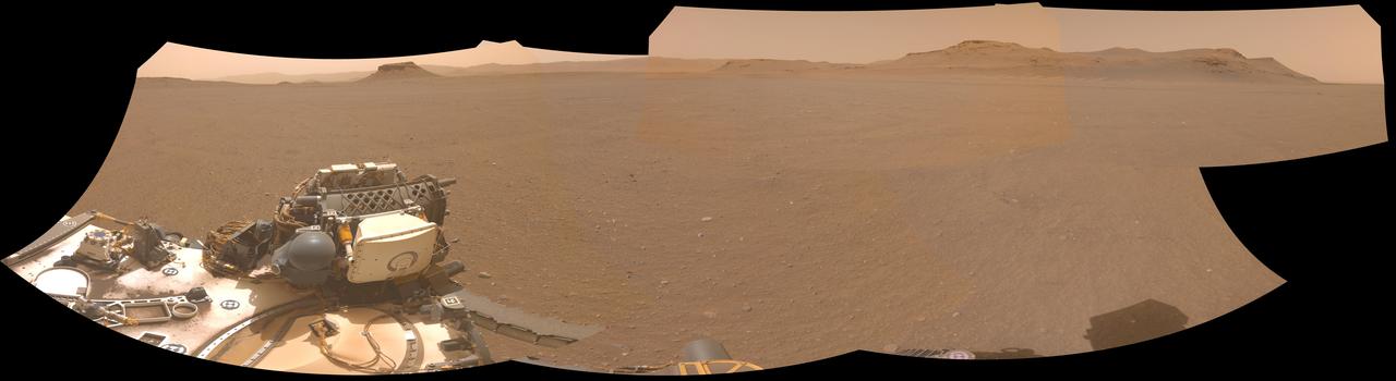 NASA's Perseverance Mars rover used one of its navigation cameras to take this panorama of a proposed landing site for the Mars Sample Return lander. The lander would collect rock and sediment samples that Perseverance has taken and would also serve as the launch platform for a Mars Ascent Vehicle that would blast off from Mars, delivering the samples to an orbiter as part of their journey to Earth for intensive study.  Choosing an area that lacks large rocks (especially those over 7 1/2 inches, or 19 centimeters, in diameter), sand dunes, and steeply angled terrain would go a long way toward easing the path for an MSR recovery vehicle to efficiently grab tubes before heading to the lander.  This panorama is made up of five images taken on April 14, 2022 (the 409th Martian day, or sol, of the mission) and stitched together back on Earth. The color has been adjusted to match the lighting conditions as the human eye would perceive them on Earth.  A key objective for Perseverance's mission on Mars is astrobiology, including the search for signs of ancient microbial life. The rover will characterize the planet's geology and past climate, pave the way for human exploration of the Red Planet, and be the first mission to collect and cache Martian rock and regolith (broken rock and dust).  Subsequent NASA missions, in cooperation with ESA (European Space Agency), would send spacecraft to Mars to collect these sealed samples from the surface and return them to Earth for in-depth analysis.  The Mars 2020 Perseverance mission is part of NASA's Moon to Mars exploration approach, which includes Artemis missions to the Moon that will help prepare for human exploration of the Red Planet.  https://photojournal.jpl.nasa.gov/catalog/PIA25406