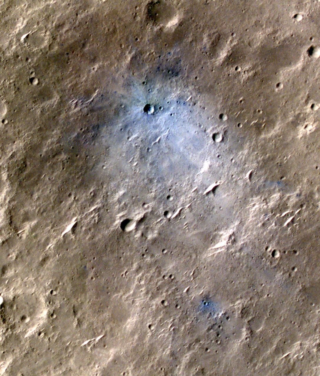 NASA's Mars Reconnaissance Orbiter captured this image of a meteoroid impact that was later associated with a seismic event detected by the agency's InSight lander using its seismometer. This crater was formed on May 27, 2020. MRO's Context Camera originally located the impact. Then, the spacecraft's High Resolution Imaging Science Experiment (HiRISE) camera captured this scene in color. The ground is not actually blue; this enhanced-color image highlights certain hues in the scene to make details more visible to the human eye – in this case, dust and soil disturbed by the impact. https://photojournal.jpl.nasa.gov/catalog/PIA25410