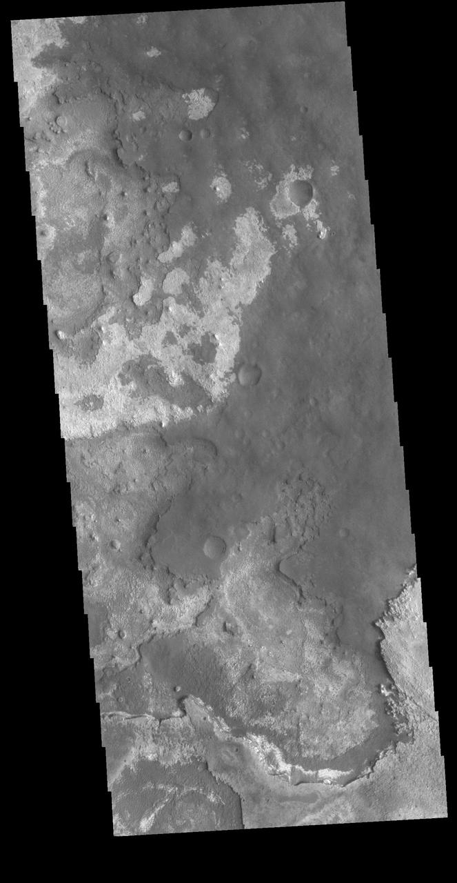 This VIS image shows layering of surface materials in Meridiani Planum. TES (Thermal Emission Spectrometer) initially detected hematite in a surface layer, which was confirmed by THEMIS (THrmal EMision Imaging System). These findings supported a water rich origin of the hematite and led to the selection of the site for the Opportunity MER (Mars Exploration Rover). The TES instrument was located on the Mars Global Surveyor spacecraft. THEMIS is onboard the Mars 2001 Odyssey spacecraft. Orbit Number: 89658 Latitude: 1.83323 Longitude: 0.267191 Instrument: VIS Captured: 2022-03-01 17:54 https://photojournal.jpl.nasa.gov/catalog/PIA25457