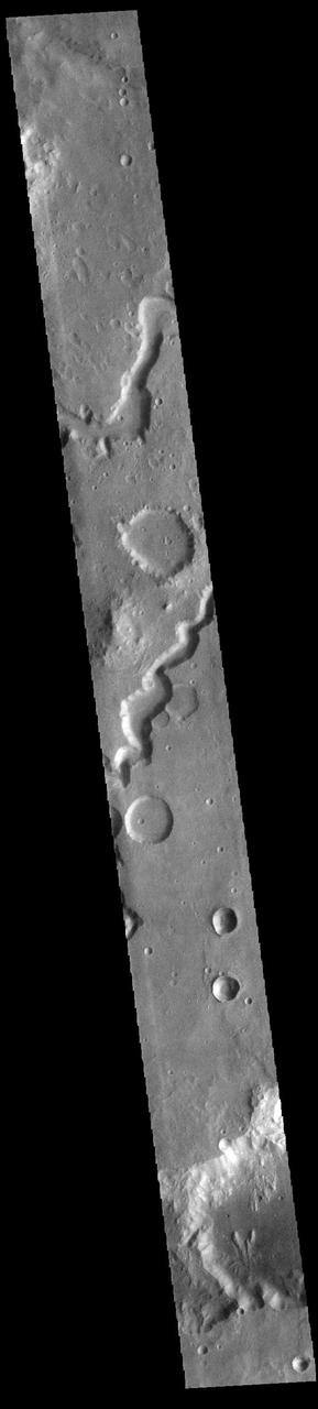 This VIS image shows part of Nanedi Valles. Located In Xanthe Terra, the channel system is 508 km (315 miles) long. Nanedi Valles contains two large channels that join together as the elevation drops near Chryse Planitia. Both sections of channel are visible in this image. Orbit Number: 89747 Latitude: 6.03809 Longitude: 312.054 Instrument: VIS Captured: 2022-03-09 01:48 https://photojournal.jpl.nasa.gov/catalog/PIA25460